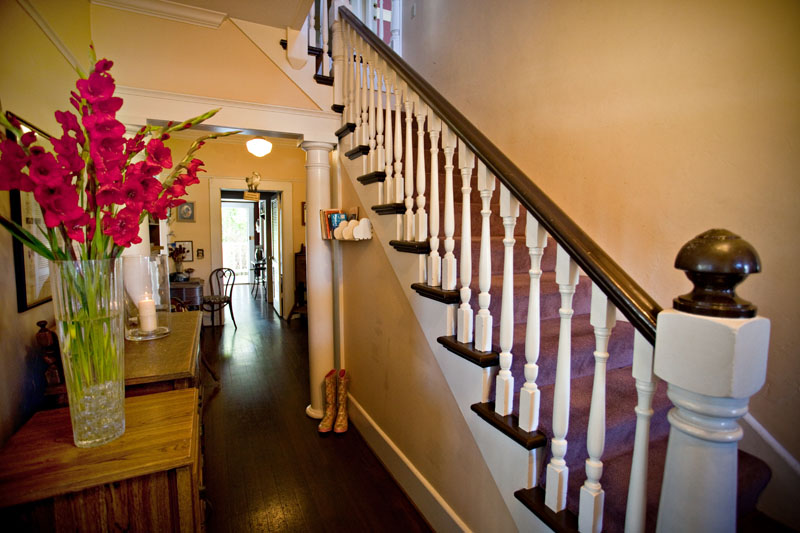 The front hall and staircase with its turned wooden balusters