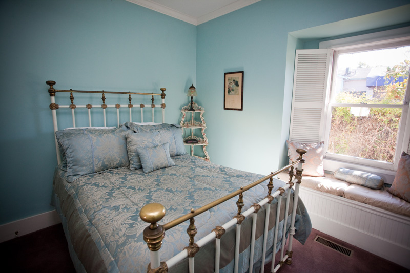 Jasmine Room, with an antique brass bed and a window seat