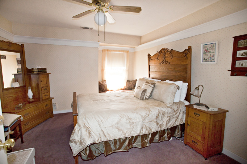 Grandpa's Room, with a grand carved oak bed